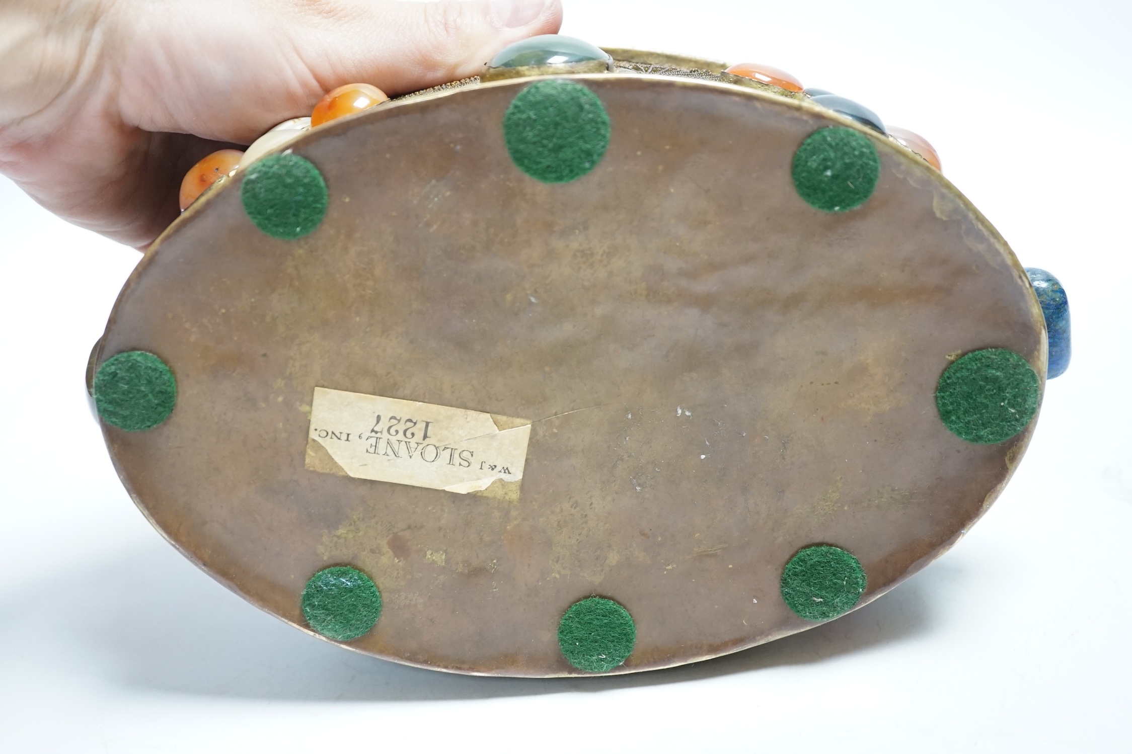 A brass filigree work and agate cabochon mounted oval box, 19cm wide